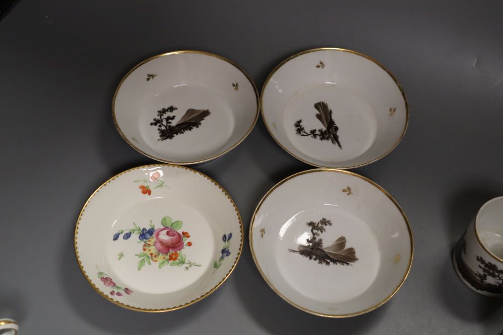 A Frankenthal coffee can and saucer painted with a large rose and other flowers and three Paris porcelain coffee cans and saucer
